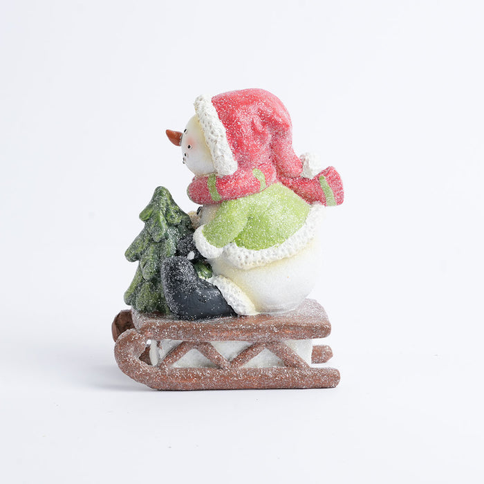 Christmas Snowman on Sled Figurine Showpiece